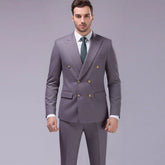 Slim fit double-breasted gray suit with gold buttons, white shirt, and green tie