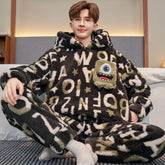 Man wearing fuzzy black and green letter print loungewear set with oversized fit and monster patch