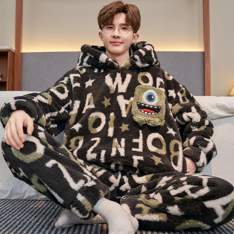 Man wearing fuzzy black and green letter print loungewear set with oversized fit and monster patch