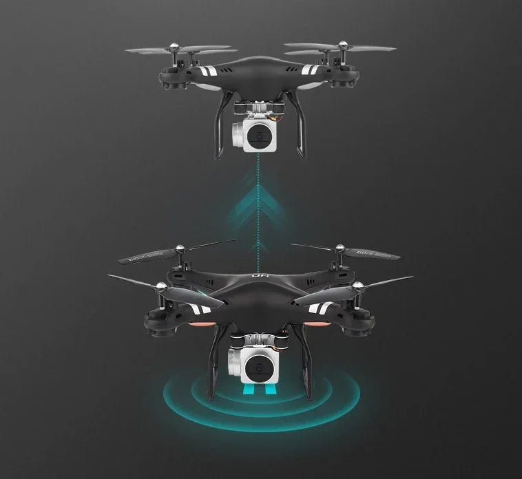 Black quadcopter drones with mounted cameras, matte finish, flying on dark background.