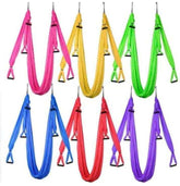 Colorful nylon aerial yoga hammocks with sturdy loops, available in pink, yellow, green, blue, red, and purple.