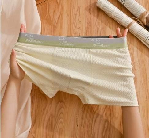 Stretchy cream ribbed boxer briefs with light gray waistband, soft fabric, relaxed fit