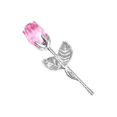 Silver metal rose brooch with pink crystal flower and two detailed leaves