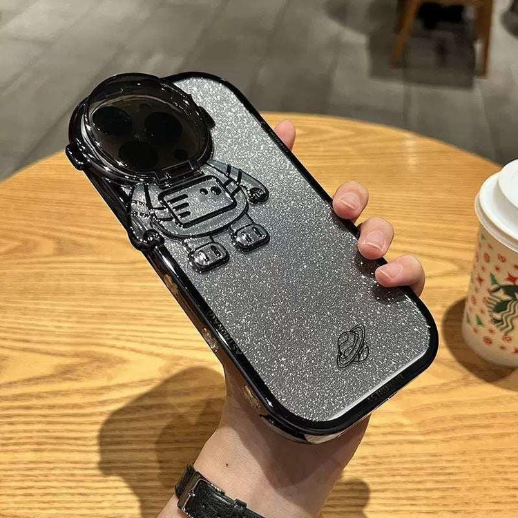 Glittery silver phone case with black robot design, metallic finish, slim fit, tech accessory