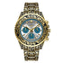 Ornate gold and black metal watch with intricate engraving, blue chronograph dials, silver face