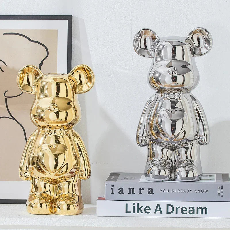 Gold and silver metallic bear figurines on a shelf, modern home decor accents