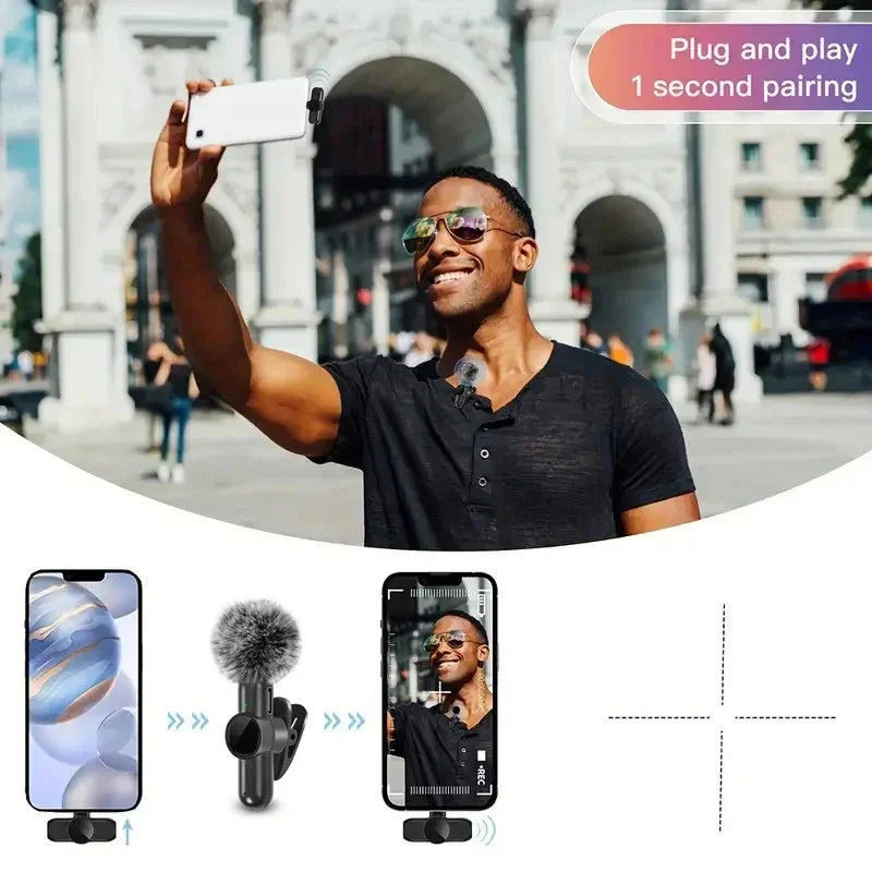 Man wearing fitted black short-sleeve henley shirt and sunglasses, taking selfie outdoors