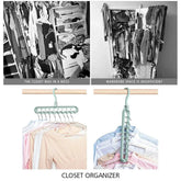 Closet organizer hanger holding pastel and white tops, showing space-saving clothing storage