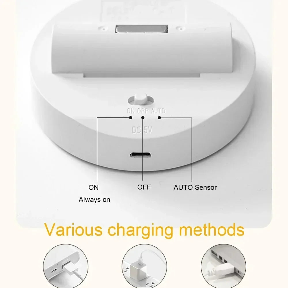 White circular LED base with USB charging port, on-off-auto switch, and various charging options