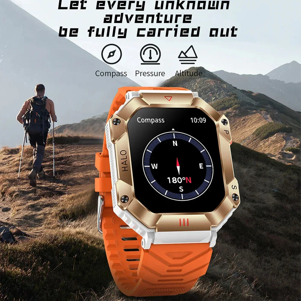 Outdoor smartwatch with orange silicone strap, rugged gold case, and digital compass display, shown in a hiking mountain setting.