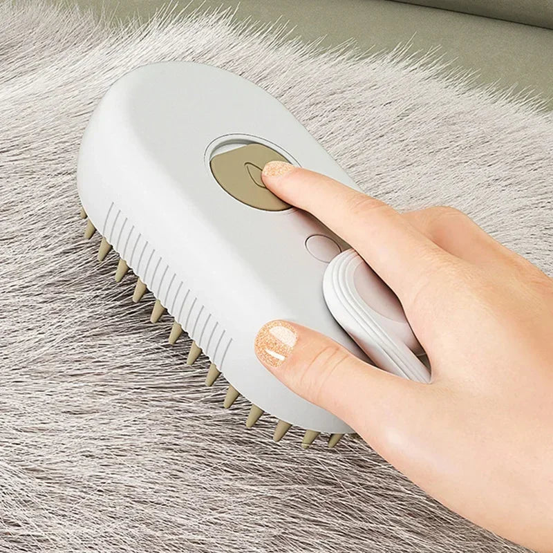 Hand using a white plastic pet grooming brush on soft gray fur