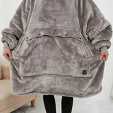 Oversized grey fleece hoodie blanket with large front pocket and relaxed fit