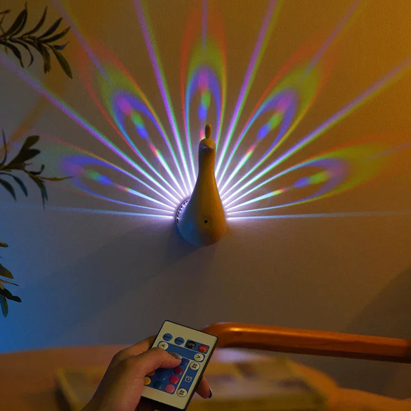 Peacock-shaped wall light with remote, multicolor LED projection on wall
