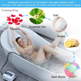 Woman relaxing in a bubble bath wearing a nude bikini, surrounded by rose petals, with salt, ginger, bath bombs, and essential oils highlighted for aromatherapy bath benefits.