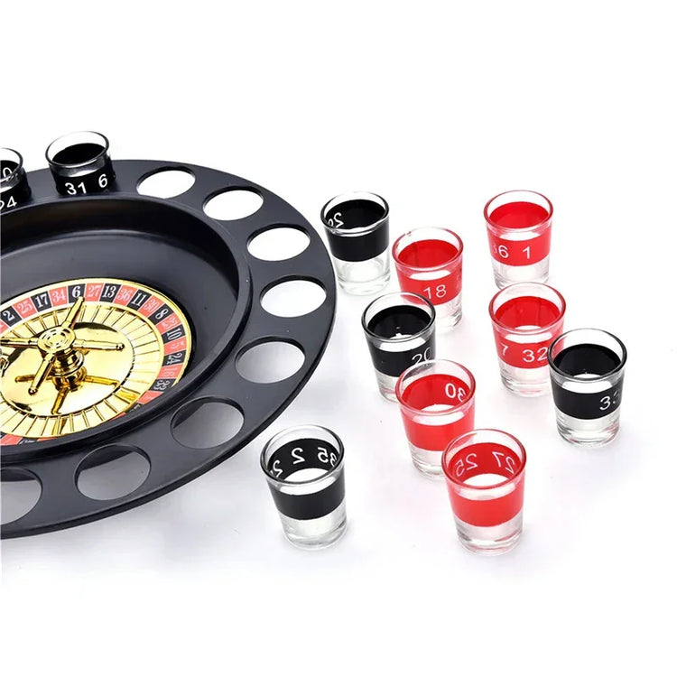 Roulette drinking game set with black and red numbered shot glasses on white background