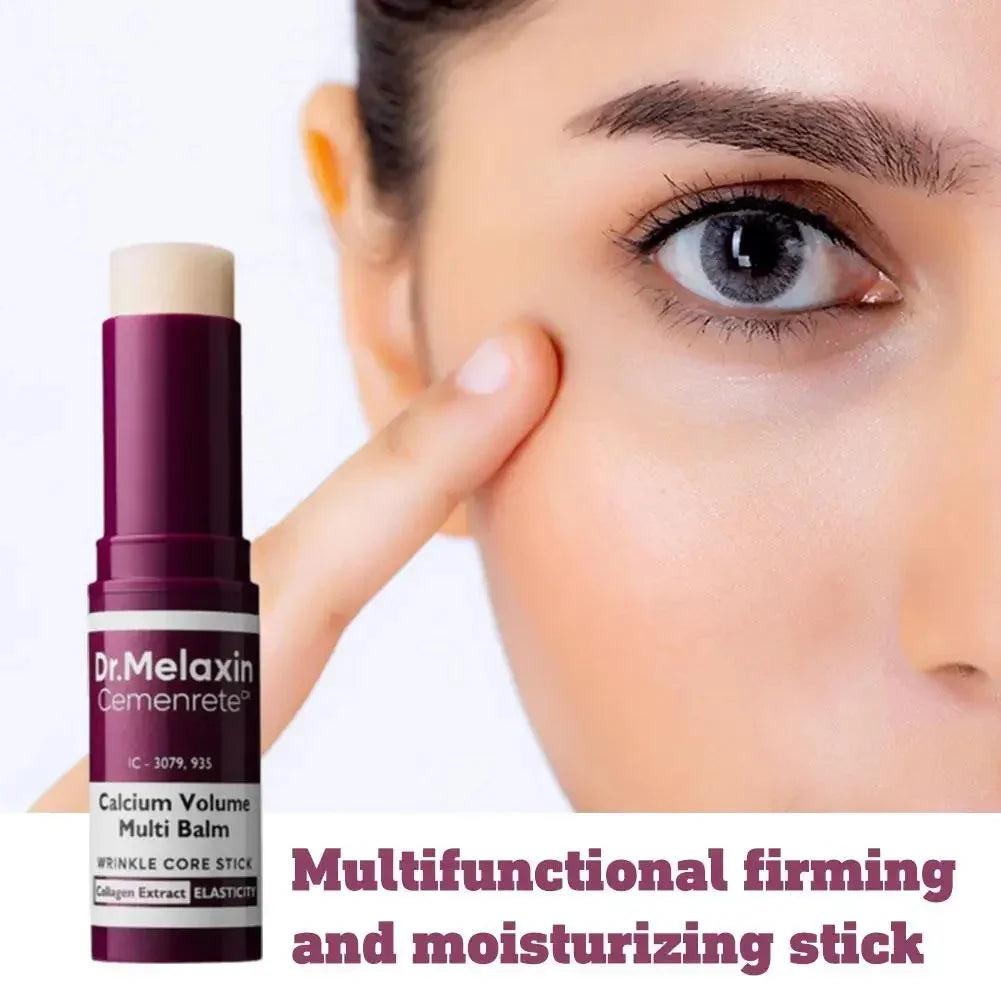 Beige moisturizing balm stick for firming skin, close-up woman applying near eye