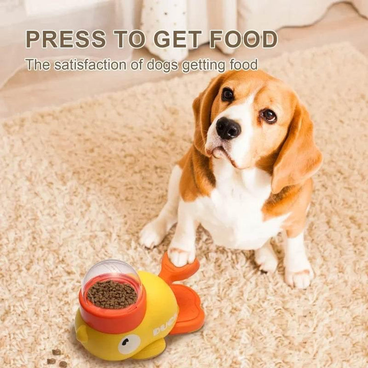 Beagle dog sitting on beige carpet with interactive yellow fish-shaped food dispenser toy.