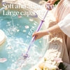 Purple water wand with spinning droplet feature, held near fountain with floating petals, soft absorbent design