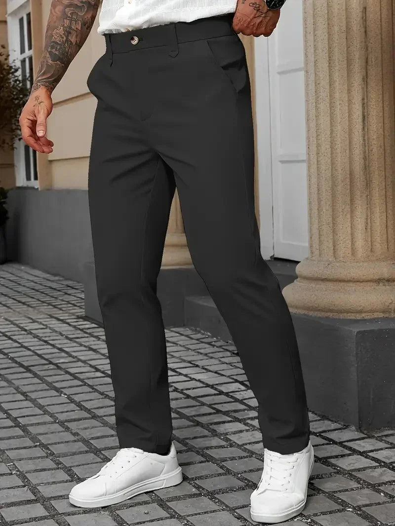 Slim fit black dress pants for men, flat front, with side pockets and white sneakers