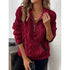 Woman wearing a red textured fleece pullover with half-zip front and relaxed fit