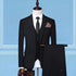 Classic black three-piece suit with notched lapel, white dress shirt, slim fit, and tie on mannequin