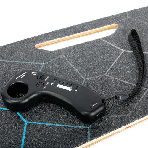 Black wireless remote control on a textured electric skateboard deck with geometric design