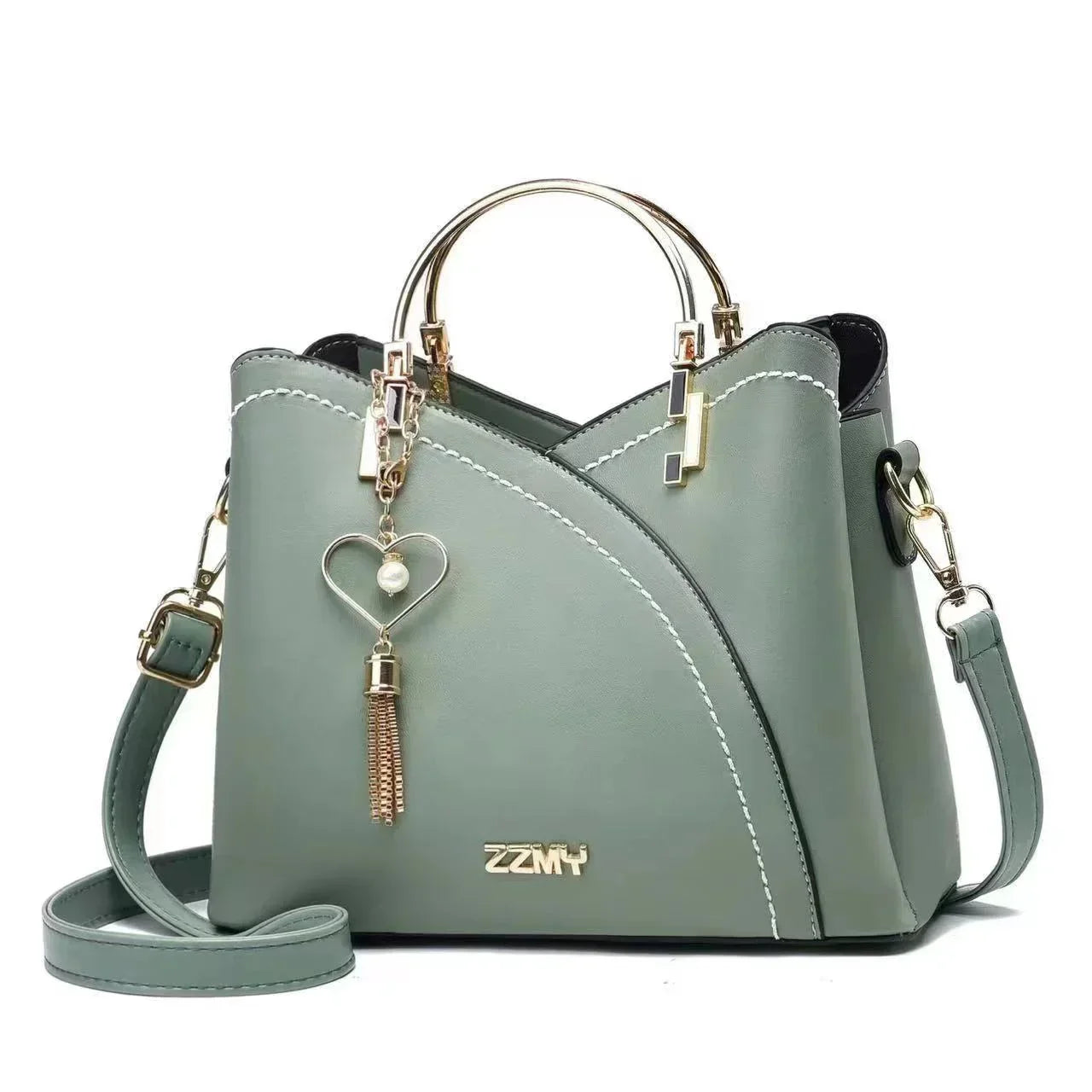 Sage green faux leather handbag with gold hardware, heart charm, and adjustable shoulder strap
