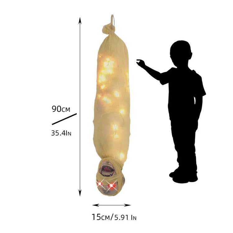 Hanging cocoon Halloween prop with glowing lights, wrapped in beige fabric, 90 cm tall.