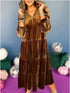 Brown velvet tiered long-sleeve midi dress with relaxed fit, worn by woman
