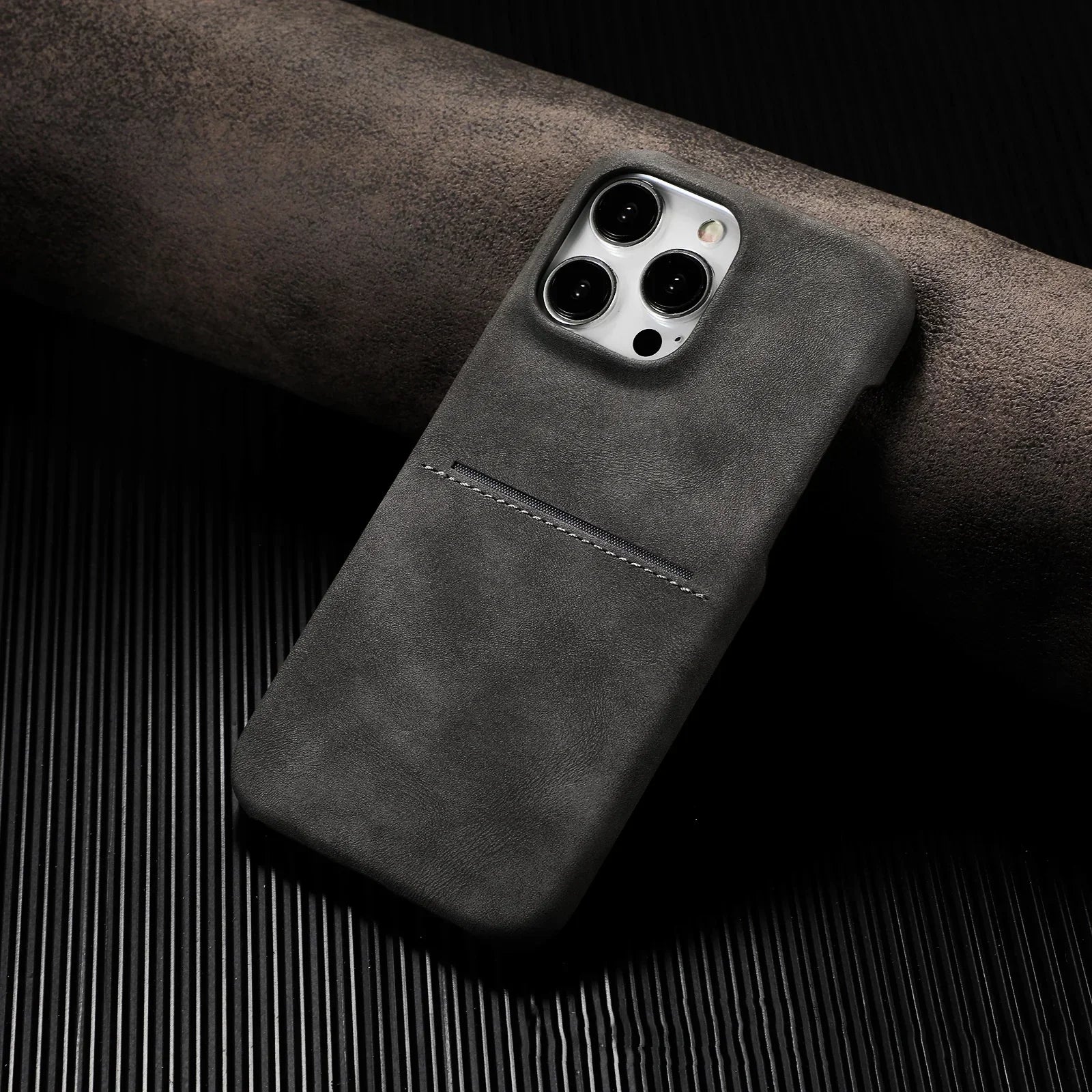 Matte black suede phone case with slim fit and single stitched card slot, modern style
