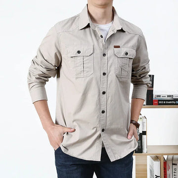 Men's beige long-sleeve button-up shirt, cotton material, relaxed fit, chest pockets.