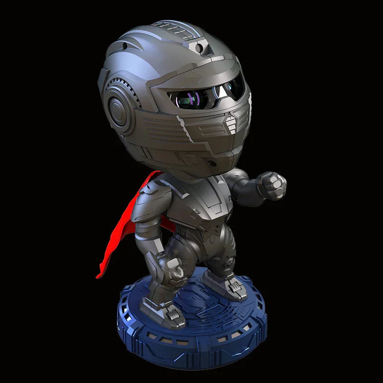 Futuristic metallic robot figurine with red cape and armored suit on round base