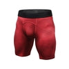 Red geometric-patterned compression shorts with black waistband, form-fitting athletic wear