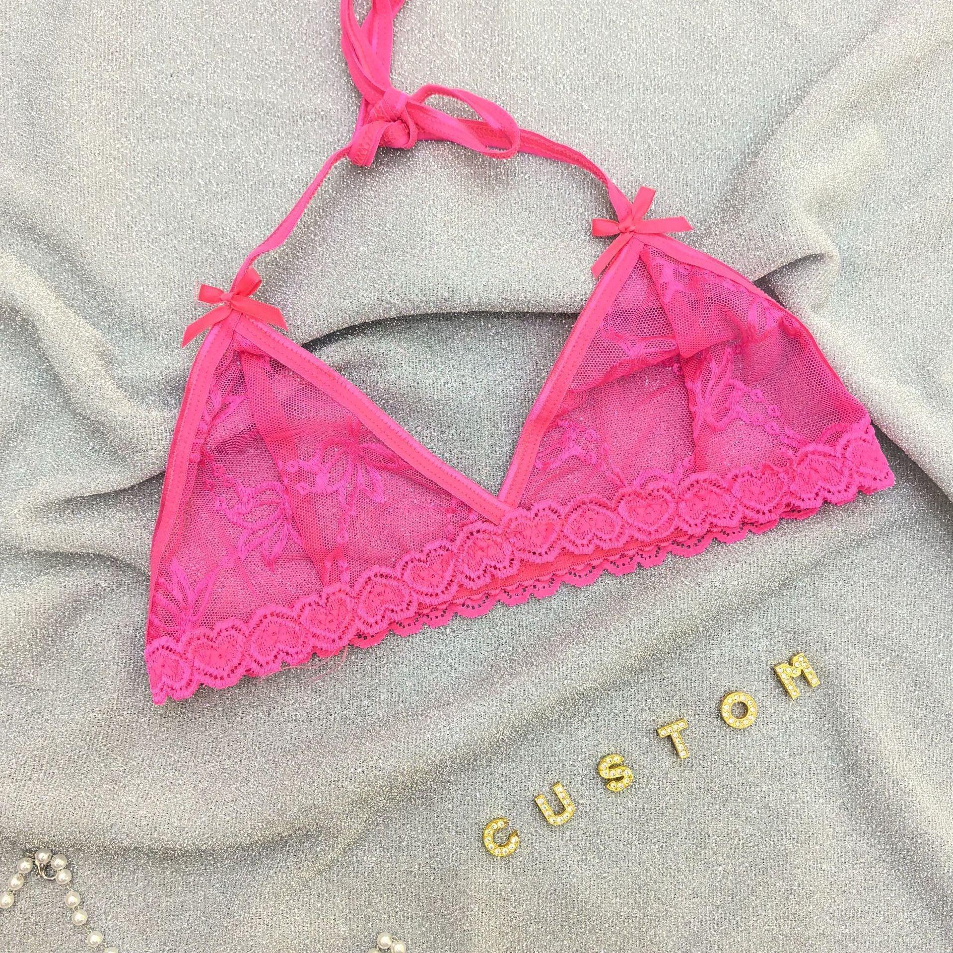 Hot pink lace bralette with floral mesh, scalloped trim, adjustable halter strap on silver fabric