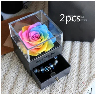 Gift box with a preserved rainbow rose and drawer containing silver and blue beaded bracelet