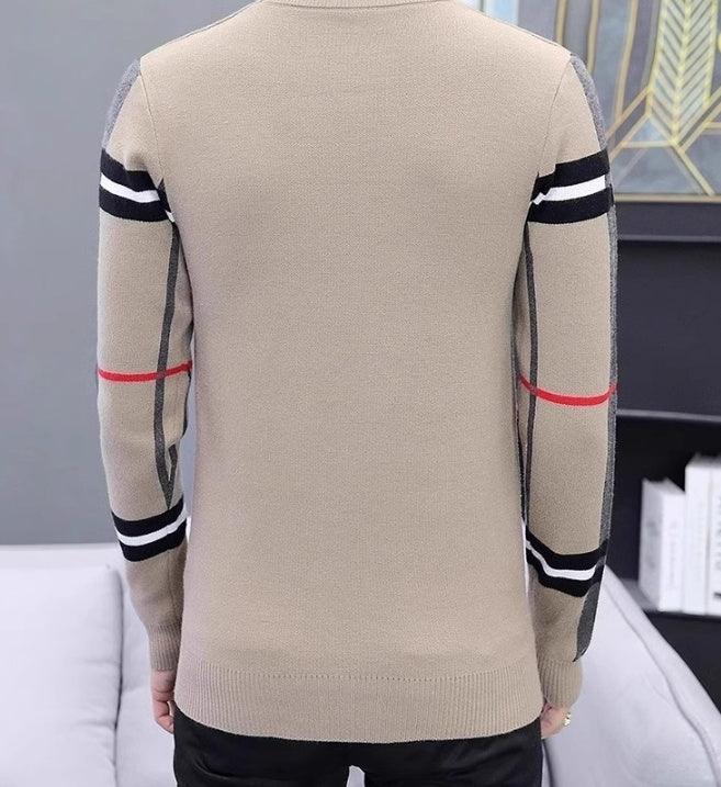Beige fitted knit sweater with black, white, and red striped sleeves, modern streetwear style