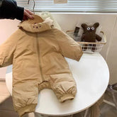 Beige padded baby jumpsuit with front zipper, bear face detail, long sleeves, and ribbed cuffs