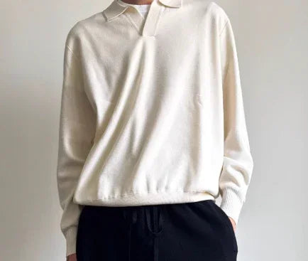 Minimalist off-white knit long sleeve polo shirt with relaxed fit and black drawstring pants