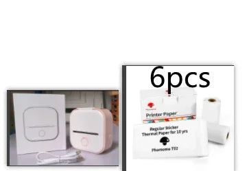Compact white portable thermal printer with charging cable and six rolls of sticker printer paper.
