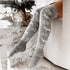 Cozy gray knit over-the-knee socks with winter snowflake and deer pattern, fitted style.