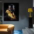 Modern wall art of a person with gold-painted accessories and black attire in a stylish room
