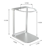 Minimalist silver metal stand with rounded base, open circular top, and dimensions labeled.