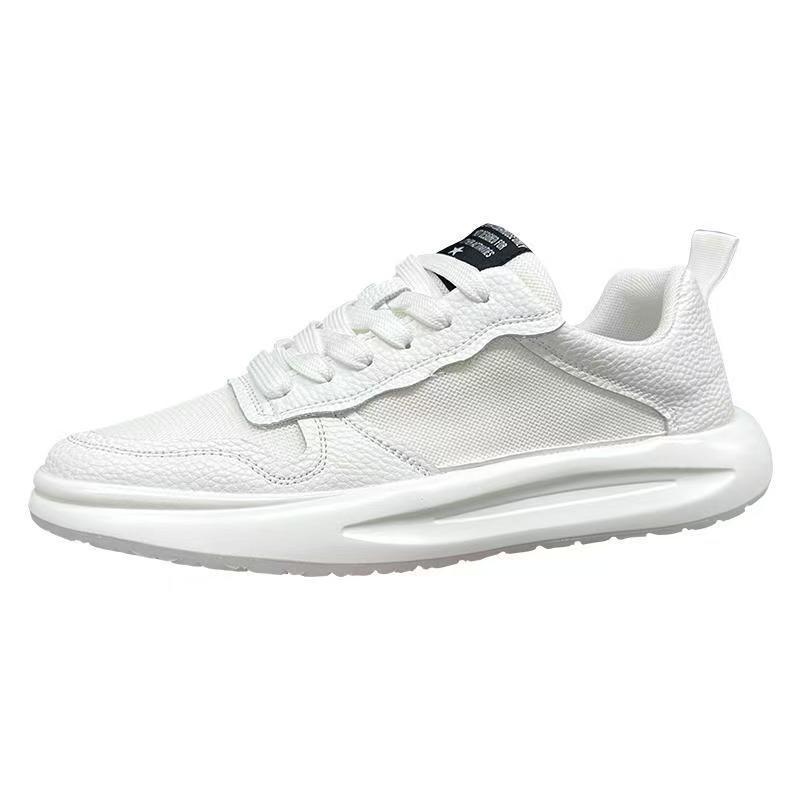 White low-top sneaker with mesh and textured panels, lace-up closure, and chunky sole.