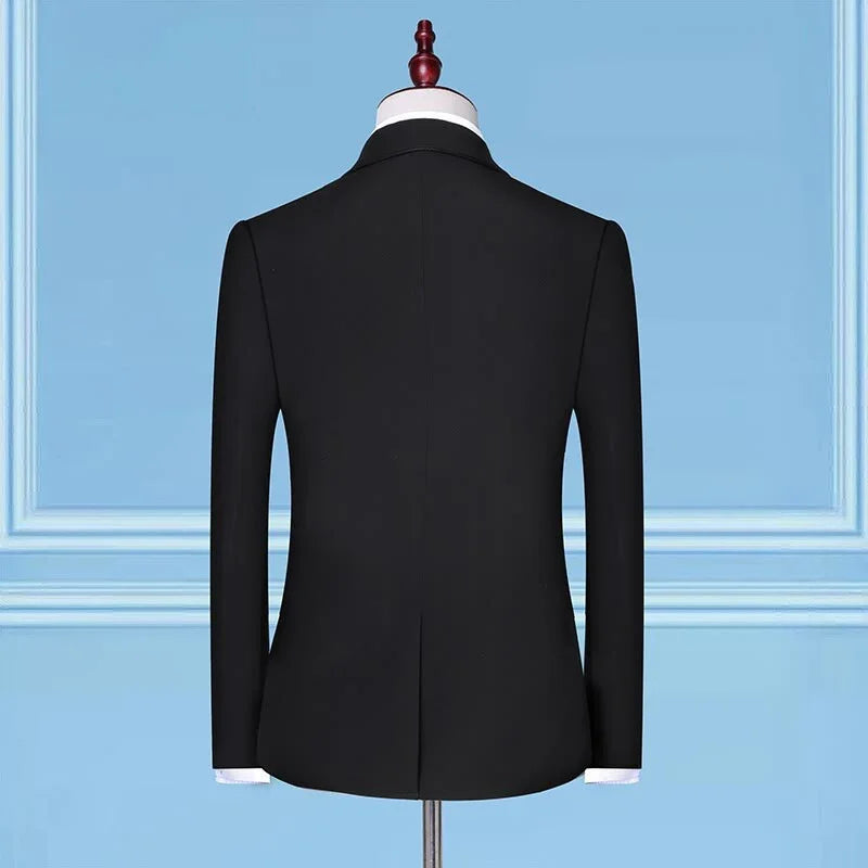 Black slim-fit blazer with long sleeves, displayed on a mannequin against a blue background