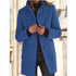 Woman wearing a blue wool coat, tailored fit, with large buttons and front pockets