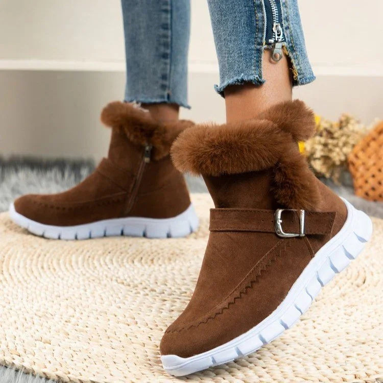 Brown suede winter boots with fur lining, buckle detail, and white rubber sole, casual fit