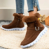 Brown suede winter boots with fur lining, buckle detail, and white rubber sole, casual fit