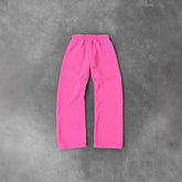 Wide-leg pink fleece sweatpants with elastic waistband, relaxed fit, on gray background