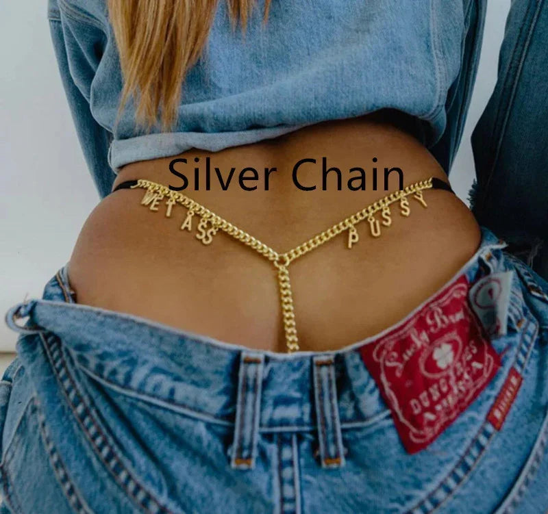 Woman wearing denim jeans and jacket, gold body chain accessory, casual streetwear style