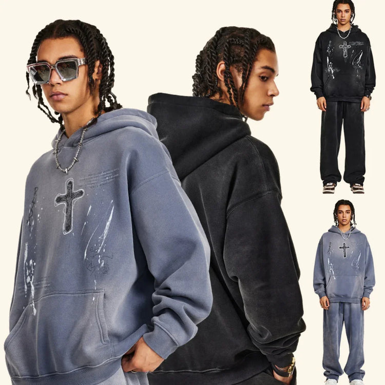 Oversized streetwear hoodies in washed black and grey with cross graphic, relaxed fit, cotton blend.